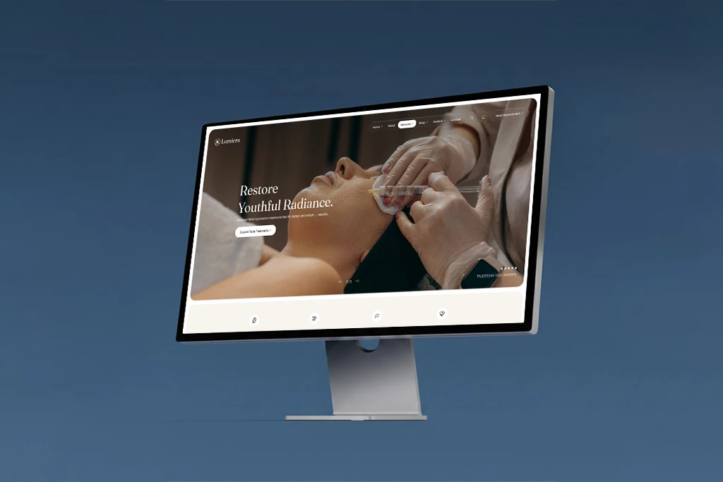 Three people having a friendly meeting at a table with laptops