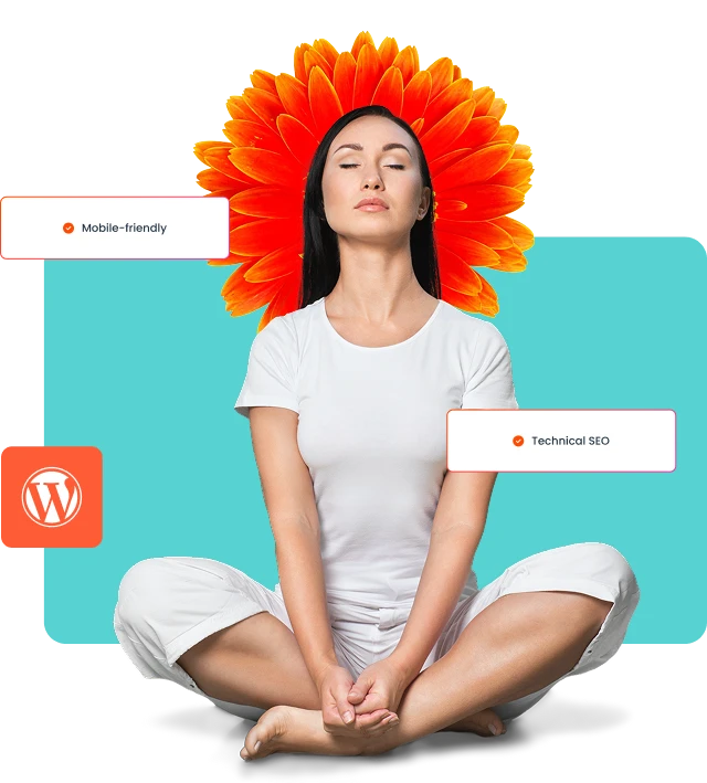 yoga_v3 A smiling woman in a business suit holding a tablet in front of a wooden wall.